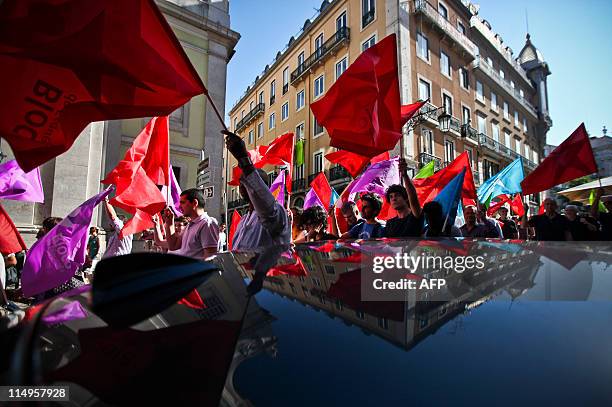 Bloco de Esquerda suporters waving party flags on May 31, 2011 during a campaign visit in Lisbon ahead of the June 5 elections. The leader of the...
