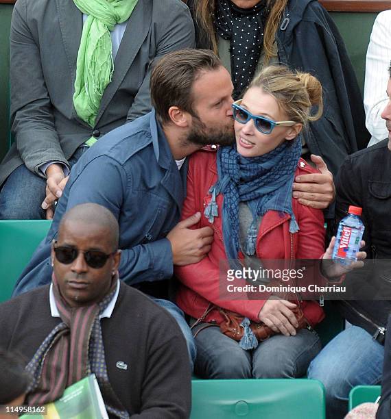 Anne Marivin and Joachim Roncin attend the French Open at Roland Garros on May 31, 2011 in Paris, France.