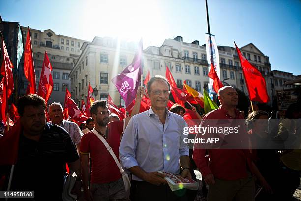 The leader of the left wing Bloco de Esquerda Party Francisco Louca is surrounded by supporters on May 31, 2011 during a campaign visit in Lisbon...