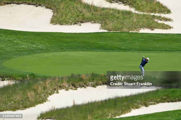 Tiger Woods of the United States plays his shot on the fourth hole during the first round of the 2019 PGA Championship at the Bethpage Black course...
