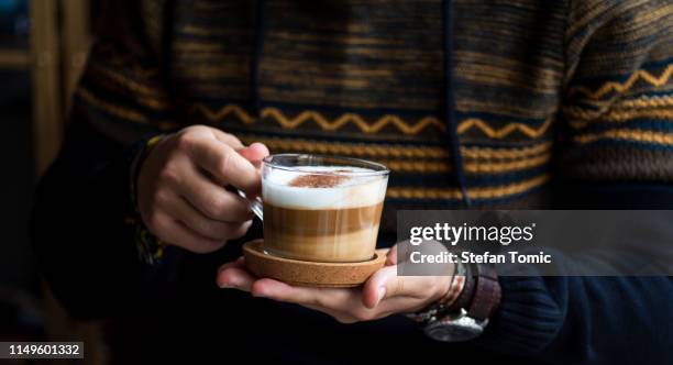 man having a cup of coffee - coffee foam imagens e fotografias de stock