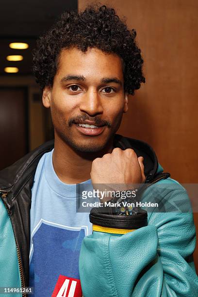 Professional snowboarder Korath Wright, a member of The Bahamas Olympic Snow boarding Team 2010 wearing a carbon 14 time piece arrives at the Benefit...