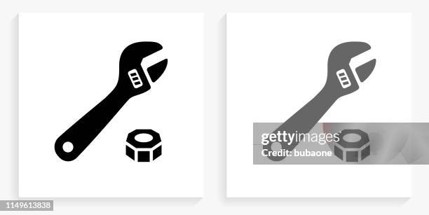 wrench & bolt black and white square icon - spanner white background stock illustrations