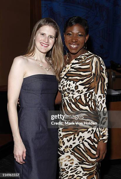 Director of PR Warner Music Group Amanda Collins poses with celebrity activist Suzanne "Africa" Engo dressed in Marc Bouwer collection and...