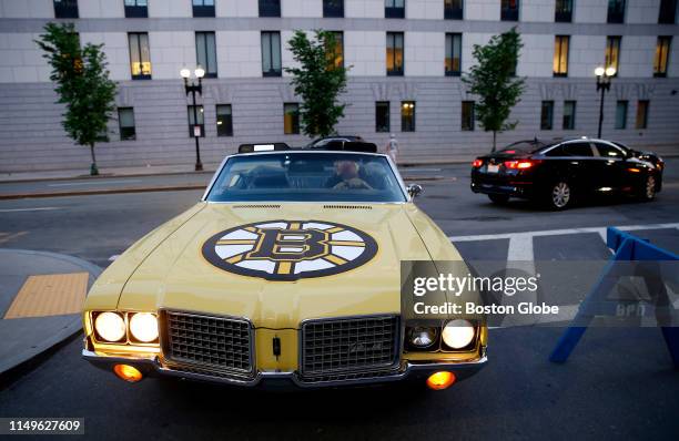 Boston Bruins fan moves his car out of the restricted area near Causeway Street before the start of the game. The Boston Bruins host the St. Louis...