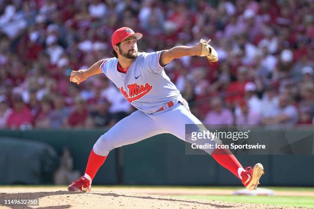 Ole Miss Rebels pitcher Parker Caracci delivers a pitch during Game 3 of the NCAA Super Regional baseball game between the Arkansas Razorbacks and...