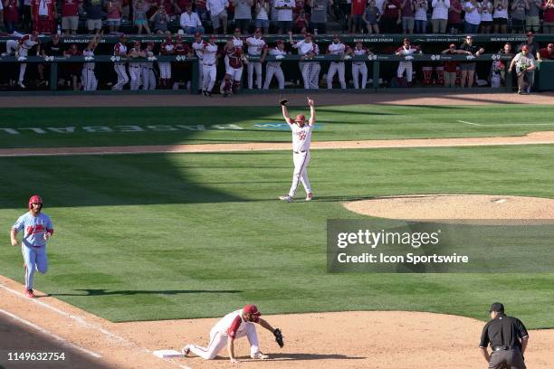 Arkansas Razorbacks Matt Cronin raises his arms after recording the final out of Game 3 of the NCAA Super Regional baseball game between the Arkansas...