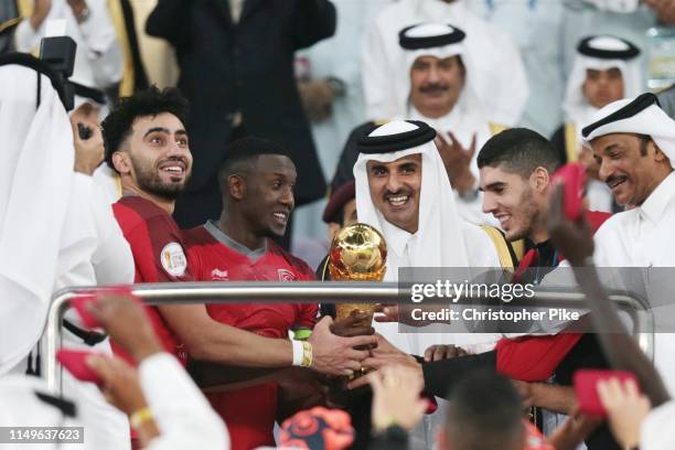 Amir of Qatar Sheikh Tamim bin Hamad Al-Thani awards players from Al Duhail the Amir Cup after the final match between Al Duhail and Al Sadd at Al...