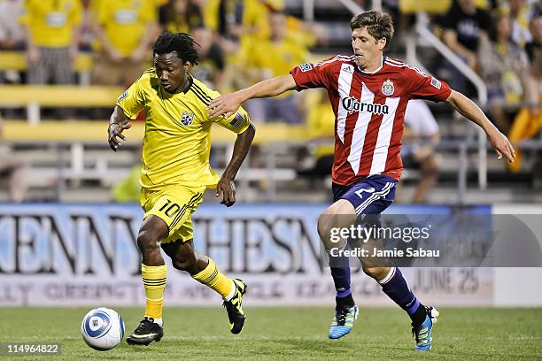 Andres Mendoza of the Columbus Crew and Andrew Boyens of Chivas USA battle for control of the ball on May 28, 2011 at Crew Stadium in Columbus, Ohio.