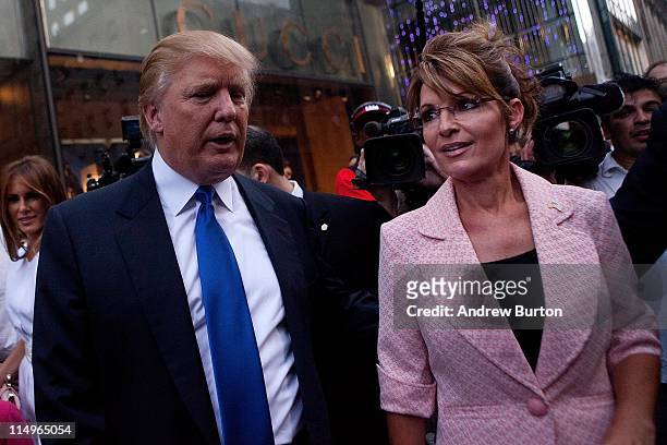 Former U.S. Vice presidential candidate and Alaska Governor Sarah Palin , and Donald Trump walk towards a limo after leaving Trump Tower, at 56th...
