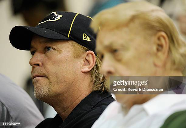 Jim Buss, executive vice president of basketball operations of the Los Angeles Lakers, listens to Lakers new coach Mike Brown's speach during his...