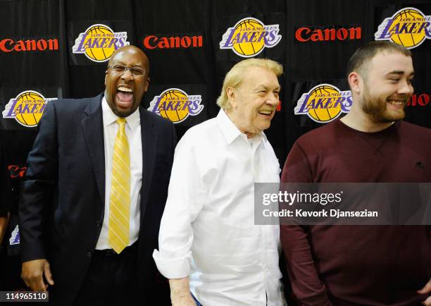 Mike Brown, the new head coach for the Los Angeles Lakers, shares a laugh with owner Jerry Buss and Buss' sons Jesse Buss after Brown's introductory...