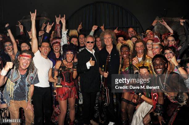 Musicians Roger Taylor and Brian May of Queen pose with cast members after the 9th anniversary performance of 'We Will Rock You' at the Dominion...