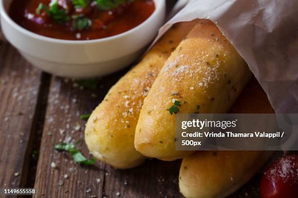 close up of garlic bread sticks - garlic bread stock pictures, royalty-free photos & images