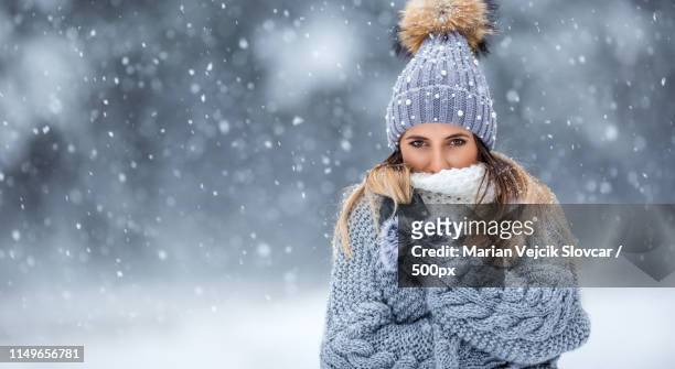 portrait of young beautiful woman in winter clothes and strong s - winter skin stock pictures, royalty-free photos & images