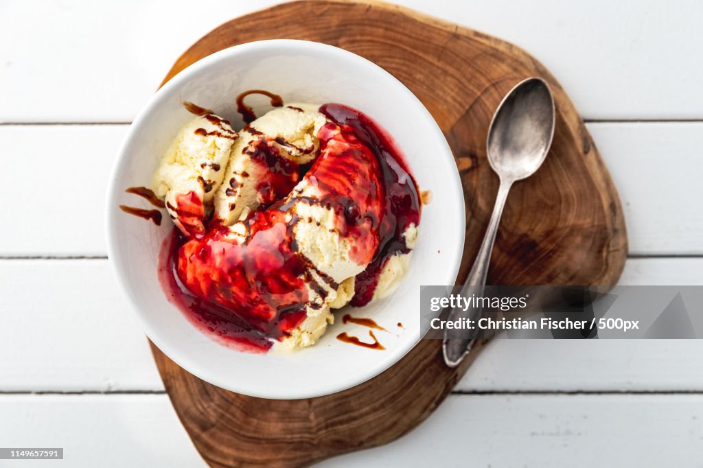 Delicious Vanilla Ice Cream With Raspberry Sauce