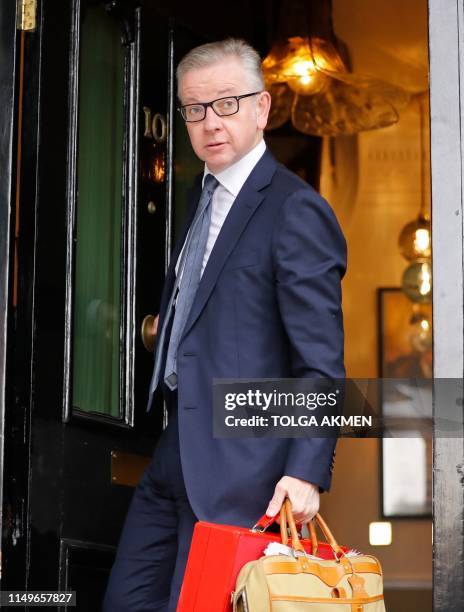 Britain's Environment, Food and Rural Affairs Secretary Michael Gove leaves his residence in London on June 13, 2019. - The 10 candidates running to...