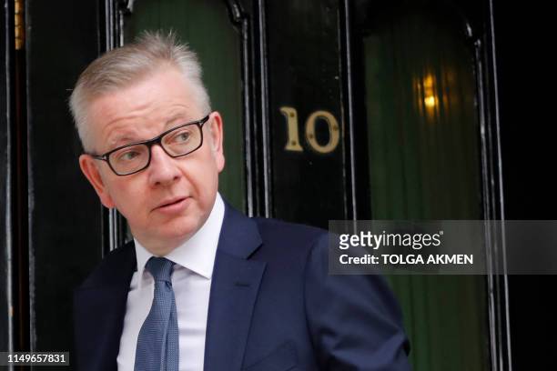 Britain's Environment, Food and Rural Affairs Secretary Michael Gove leaves his residence in London on June 13, 2019. - The 10 candidates running to...