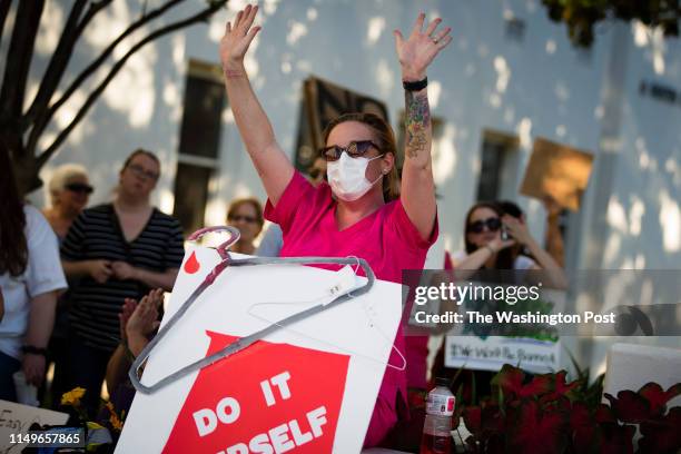 People participate in a protest against HB314, which would ban abortions in all cases except the health of the mother, outside the Alabama State...