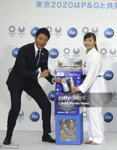 Karateka Ayumi Uekusa and former tennis pro Shuzo Matsuoka attend an event in Tokyo on June 13 for a campaign to recycle empty plastic bottles into...