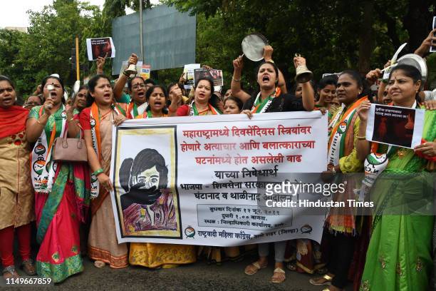 Hundred of women activists of NCP party gathers to hold protest against the increase in rape cases and cruelty act in Maharashtra at collector office...