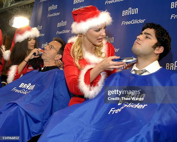 Christina Santiago, 2003 Playmate of the Year and Divini Rae, March 2003 Playmate using the Braun Free Glider shaver on volunteers