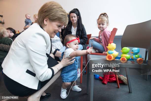 First Minister Nicola Sturgeon meets twelve-month-old Jayden Kane, in the Home-Start Dundee pre-school group in the Thomson Learning Centre during a...