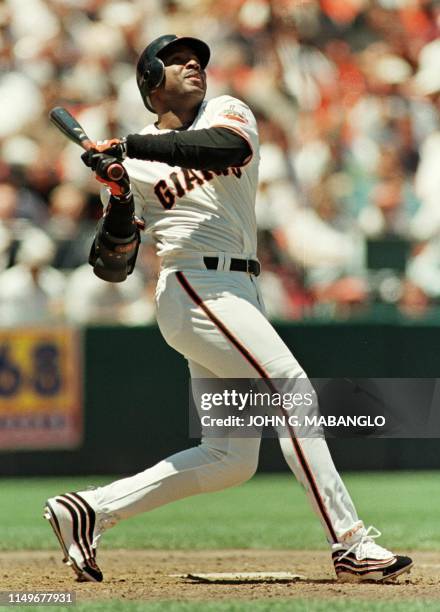 San Francisco Giants player Barry Bonds watches his ball turn into a pop fly against the Anaheim Angels 09 June 1999 in San Francisco. Bonds made his...