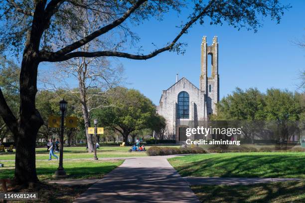 campus view of southwestern university in early spring with students walking on sitting on lawn - george town stock pictures, royalty-free photos & images