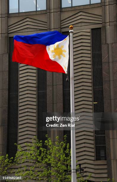 national flag of the republic of the philippines on a flagpole waves with the wind - philippines flag stock pictures, royalty-free photos & images