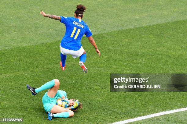 Brazil's forward Cristiane jumps over Australia's goalkeeper Lydia Williams during the France 2019 Women's World Cup Group C football match between...