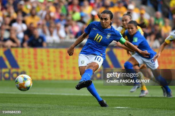 Brazil's forward Marta hits and scores a penalty kick during the France 2019 Women's World Cup Group C football match between Australia and Brazil,...