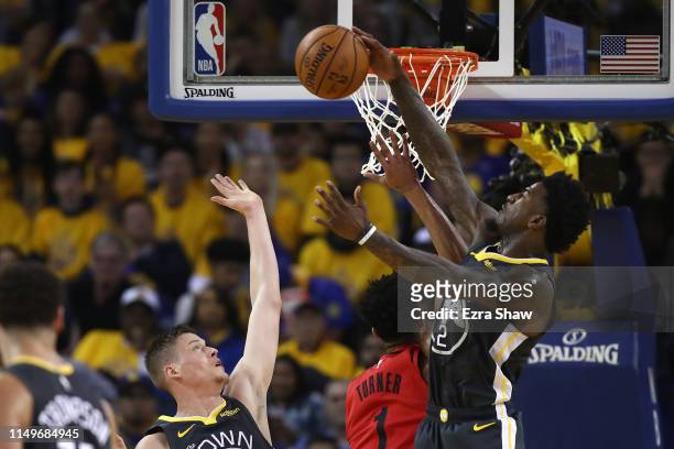 Jordan Bell of the Golden State Warriors blocks a shot against Evan Turner of the Portland Trail Blazers in game two of the NBA Western Conference...