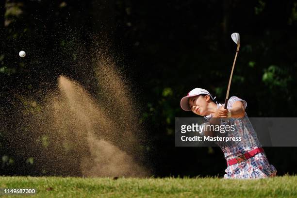 Kotone Hori of Japan hits out from a bunker on the 12th hole during the first round of the Hoken-no-Madoguchi Ladies at Fukuoka Country Club Wajiro...