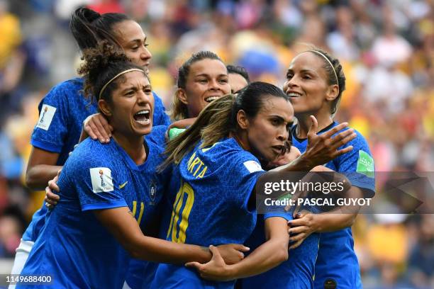 Brazil's forward Cristiane celebrates with teammates after scoring a goal during the France 2019 Women's World Cup Group C football match between...