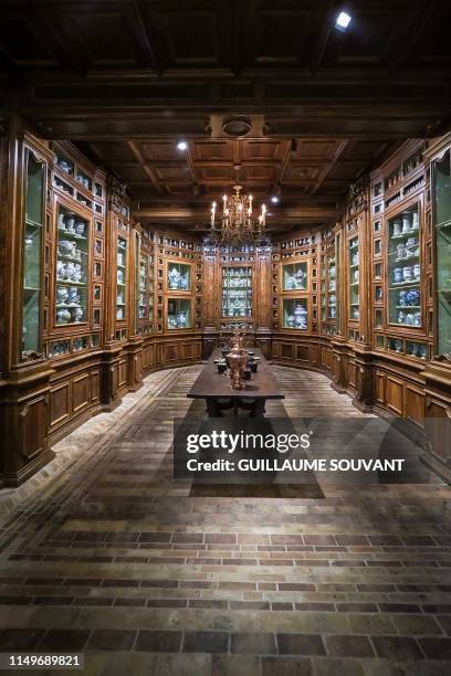 The reproduction of the apothecary of France's queen Catherine de Medicis composed of more than 500 vials, pots and bottle is pictured at the Castle...