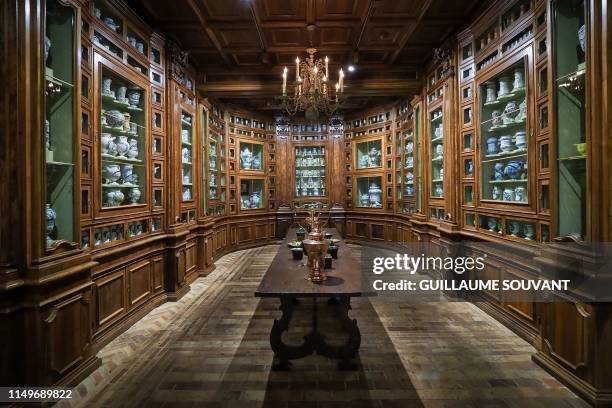 The reproduction of the apothecary of France's queen Catherine de Medicis composed of more than 500 vials, pots and bottle is pictured at the Castle...