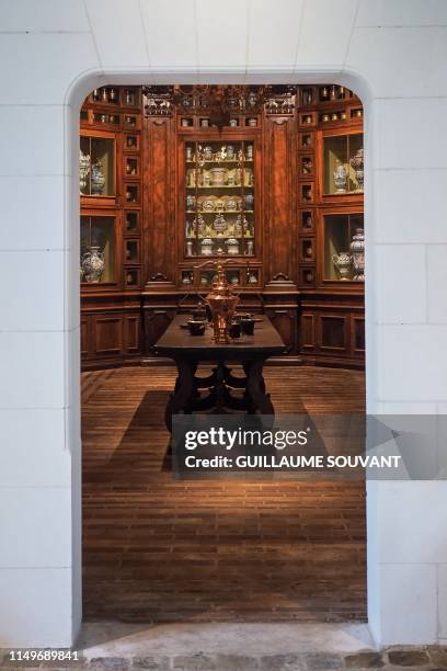 The reproduction of the apothecary of France's queen Catherine de Medicis composed of more than 500 vials, pots and bottle is pictured at the Castle...