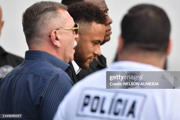 Brazilian football player Neymar arrives at the Women's Defence Precinct in Sao Paulo, Brazil on June 13, 2019 to testify after Brazilian Najila...