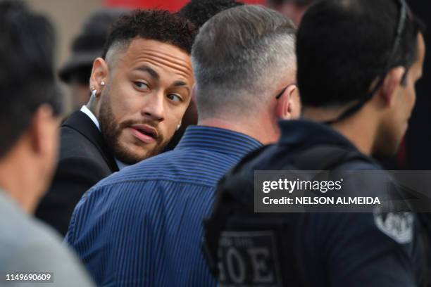 Brazilian football player Neymar arrives at the Women's Defence Precinct in Sao Paulo, Brazil on June 13, 2019 to testify after Brazilian Najila...