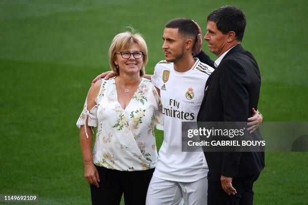 Belgian footballer Eden Hazard poses with his mother Carine and his father Thierry during his official presentation as new player of the Real Madrid...