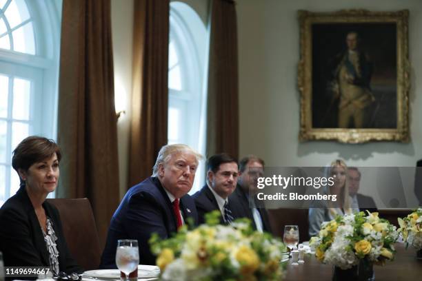 President Donald Trump, second left, listens during a working lunch with governors on workforce freedom and mobility in the Cabinet Room of the White...
