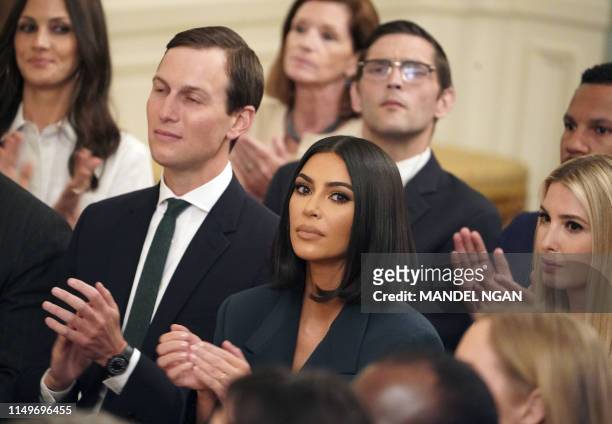 Kim Kardashian, Ivanka Trump and Jared Kushner applaud as US President Donald Trump speaks about second chance hiring and criminal justice reform in...