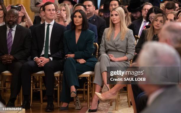 Kim Kardashian, Ivanka Trump and Jared Kushner listen as US President Donald Trump speaks about second chance hiring and criminal justice reform in...