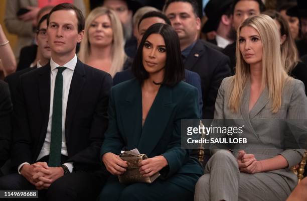 Kim Kardashian, Ivanka Trump and Jared Kushner listen as US President Donald Trump speaks about second chance hiring and criminal justice reform in...