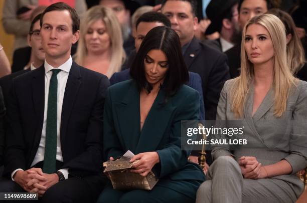 Kim Kardashian, Ivanka Trump and Jared Kushner listen as US President Donald Trump speaks about second chance hiring and criminal justice reform in...