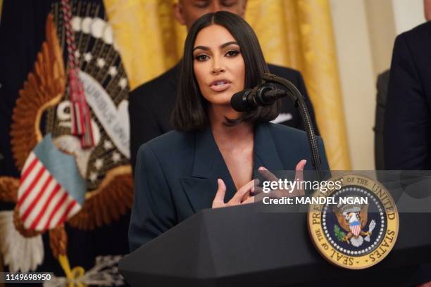 Kim Kardashian speaks as US President Donald Trump holds an event on second chance hiring and criminal justice reform in the East Room of the White...