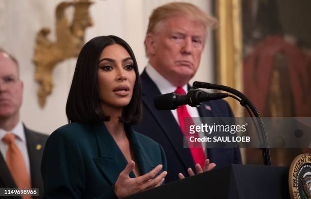 Kim Kardashian speaks as US President Donald Trump holds an event on second chance hiring and criminal justice reform in the East Room of the White...