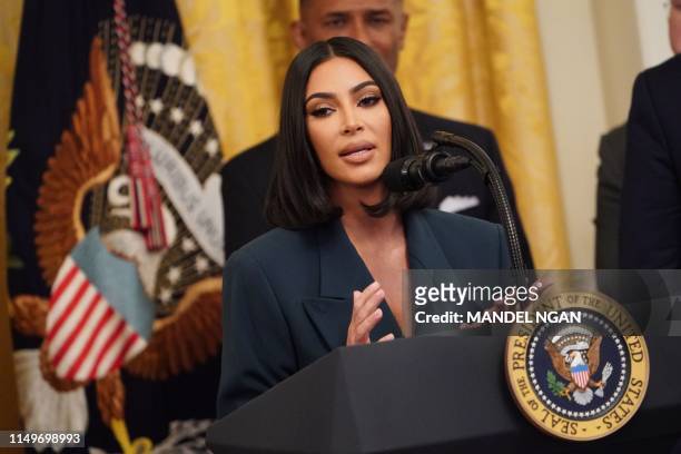 Kim Kardashian speaks as US President Donald Trump holds an event on second chance hiring and criminal justice reform in the East Room of the White...