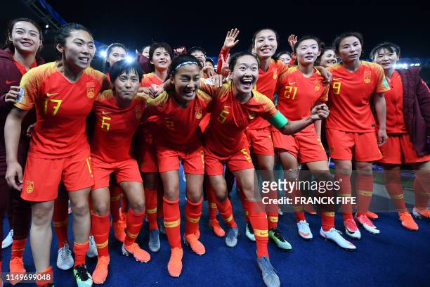 China's players celebrate their victory at the end of the France 2019 Women's World Cup Group B football match between South Africa and China, on...